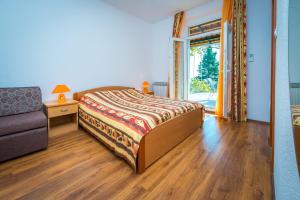 Posteľ alebo postele v izbe v ubytovaní Villa Carmen Rooms & Apartments
