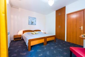 Posteľ alebo postele v izbe v ubytovaní Villa Carmen Rooms & Apartments