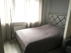 Posteľ alebo postele v izbe v ubytovaní Apartment on Avtolyubiteley