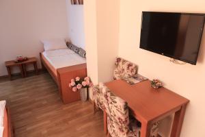 Postel nebo postele na pokoji v ubytování Pansion Centar