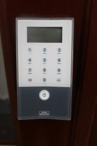 a close up of a remote control in a room at Apartment Creme zentral in Bremen