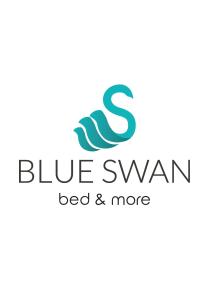 Posteľ alebo postele v izbe v ubytovaní Blue Swan