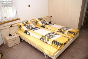 En eller flere senge i et værelse på Appartementhaus La Promenade