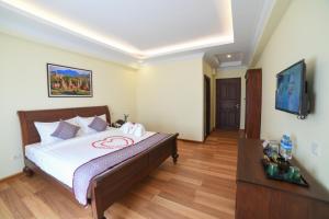 Rúm í herbergi á Bagan View Hotel