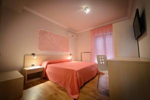 Postel nebo postele na pokoji v ubytování B&B Le Gemme