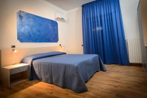Postel nebo postele na pokoji v ubytování B&B Le Gemme + 20 fotografií