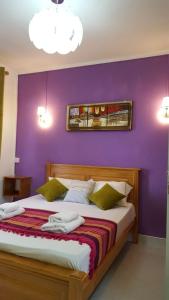 Voodi või voodid majutusasutuse Krishangel Beach Apartment toas