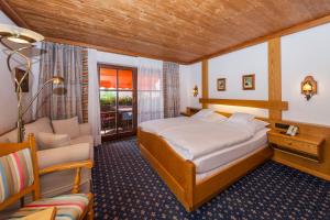 Postel nebo postele na pokoji v ubytování Hotel Alpina