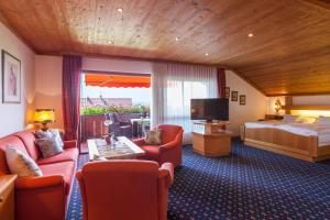 Postel nebo postele na pokoji v ubytování Hotel Alpina