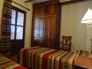 Postel nebo postele na pokoji v ubytování Hostal Rural Poqueira