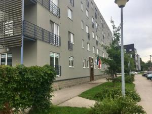 a building with people standing on the side of it at Apartment near centre in Tartu