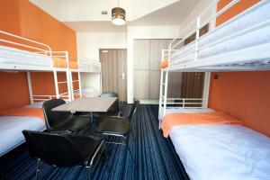 Postel nebo postele na pokoji v ubytování Planet Hostel