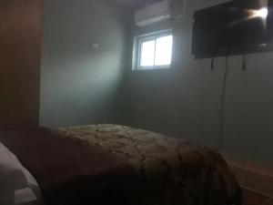 Llit o llits en una habitació de Pablo Guess House