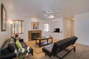 a living room with a couch and a fireplace at Red Rock Vacation Villa in Las Vegas