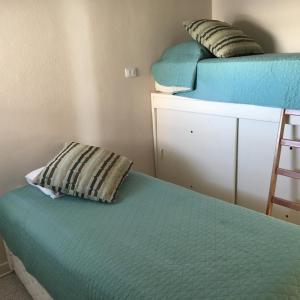 Llit o llits en una habitació de Vista Panoramica San Alfonso del Mar