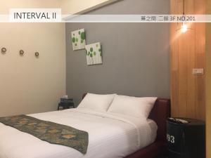 Uma cama ou camas num quarto em Interval