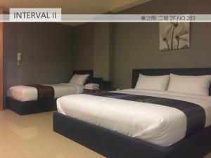 Uma cama ou camas num quarto em Interval
