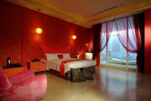Postel nebo postele na pokoji v ubytování Takao Love Motel