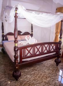 Un pat sau paturi într-o cameră la Channa Villa & Tours