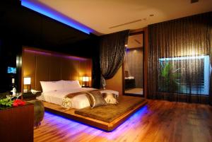 Postel nebo postele na pokoji v ubytování Takao Love Motel