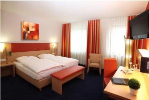 Postel nebo postele na pokoji v ubytování Hotel Silberhorn