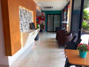 a lobby of a restaurant with tables and chairs at Sovotel Uptown 101 in Petaling Jaya +21 photos