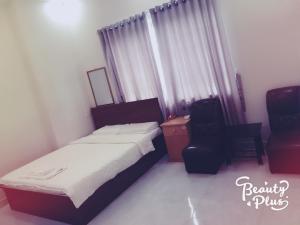 Postel nebo postele na pokoji v ubytování Phong Lan Guesthouse