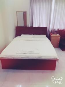 Postel nebo postele na pokoji v ubytování Phong Lan Guesthouse