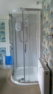 a shower with a glass enclosure in a bathroom at Hillside Bed and Breakfast in Bedale +36 photos