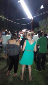 un gruppo di persone in piedi in mezzo alla folla a un evento di Kitolie Home and Lodge a Moshi