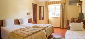 Cama ou camas em um quarto em Hotel Belsol