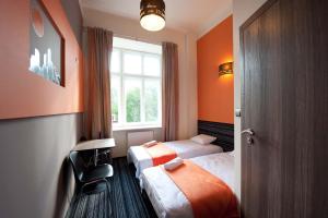 Postel nebo postele na pokoji v ubytování Planet Hostel