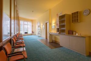 a row of chairs lined up in a waiting room at Kurzentrum Waren (Müritz) in Waren +39 photos