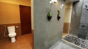 Ein Badezimmer in der Unterkunft Darra Ria Villa Ubud