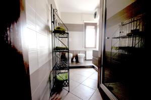 a hallway with wine racks on the wall at Al 32 y 3 in Alghero