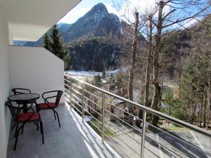 a balcony with a view of a mountain at Apartments Smolej Kranjska Gora in Kranjska Gora +35 photos