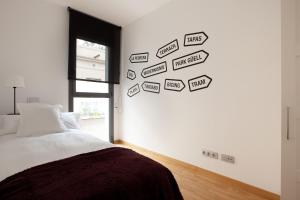 a bedroom with many street signs on the wall at AB Gracia Sant Salvador in Barcelona