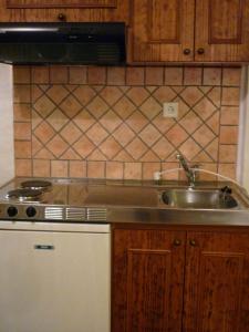 a kitchen with a sink and a stove at Archontiko Christodoulou in Vronteró +60 photos