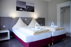 מיטה או מיטות בחדר ב-Pension zur Schmiede
