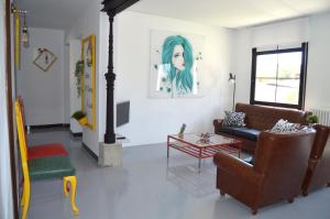 A seating area at Ohana Apartamento Rural