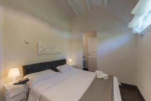 Postel nebo postele na pokoji v ubytování Villa Tipica "Arancelli 11"