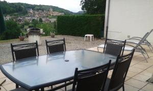 a table and chairs on a patio with a view at hortensia in Carlux