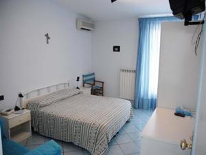 Postel nebo postele na pokoji v ubytování Maison Raphael