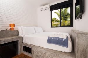 Postel nebo postele na pokoji v ubytování Savage Hostel Koh Tao