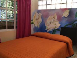 Llit o llits en una habitació de Hotel Jovita