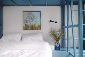Postel nebo postele na pokoji v ubytování Aekkeko hostel