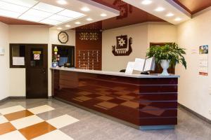 a lobby of a dental office with a reception counter at Onega Castle Hotel in Petrozavodsk
