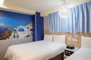 Katil atau katil-katil dalam bilik di Morwing Hotel - Culture Vogue