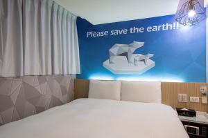 Katil atau katil-katil dalam bilik di Morwing Hotel - Culture Vogue