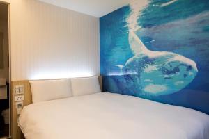Katil atau katil-katil dalam bilik di Morwing Hotel - Culture Vogue
